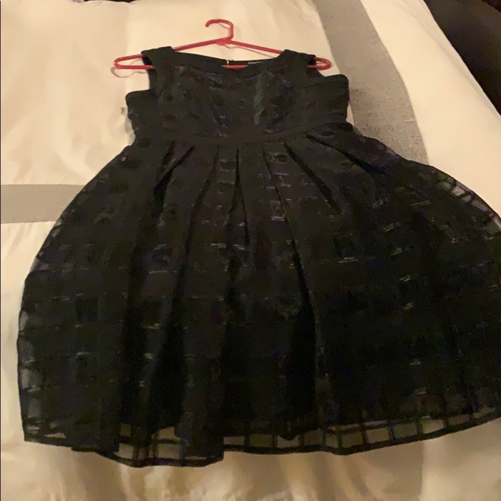 Black party dress, high neck.